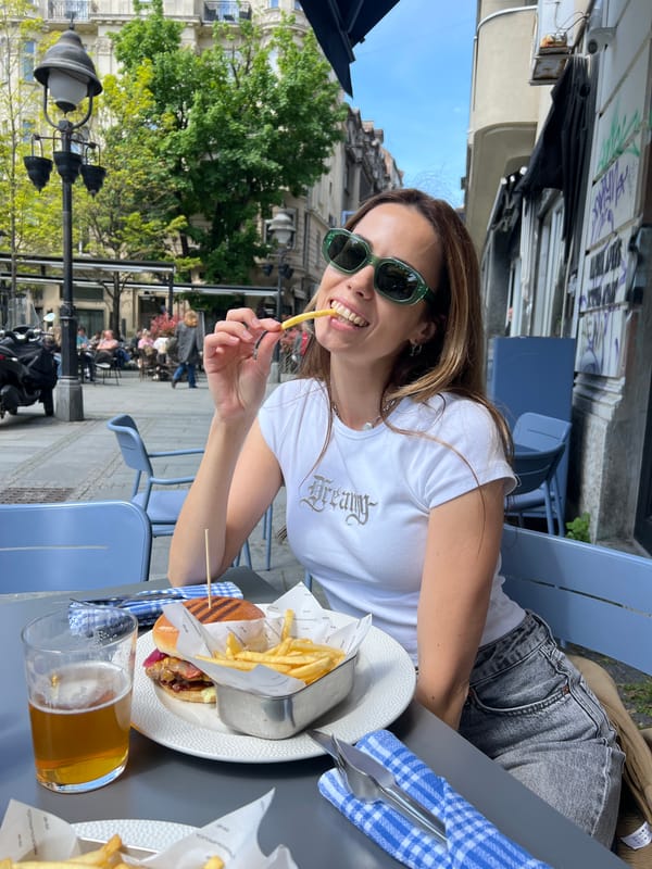 Woman enjoys outdoor dining in Belgrade on Friday morning