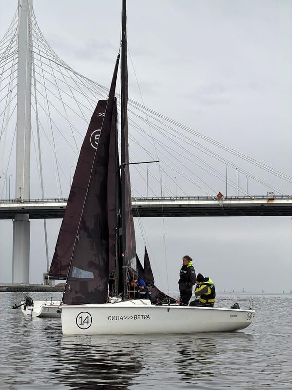 Sailboat race observed near Saint Petersburg bridge