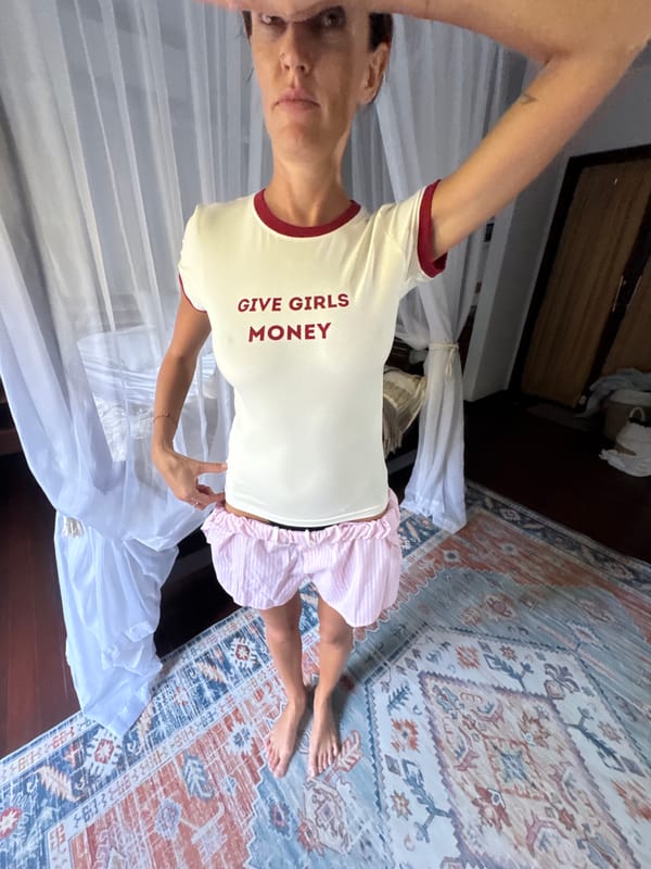 Graphic tee moment in a Kuta Selatan room, July 2026