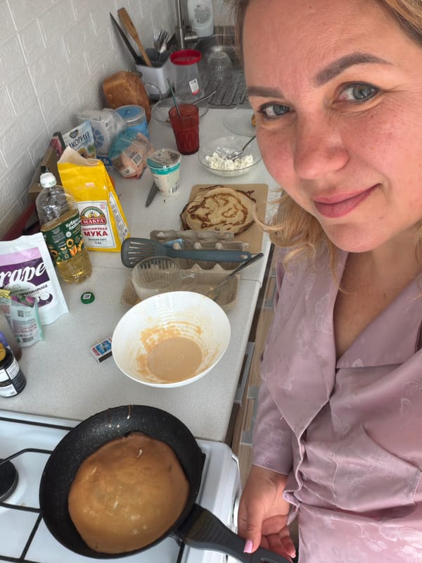 Woman enjoys breakfast in kitchen, Leningradskaya Russia