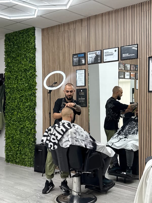 Early morning haircut session captured at Sofia barbershop