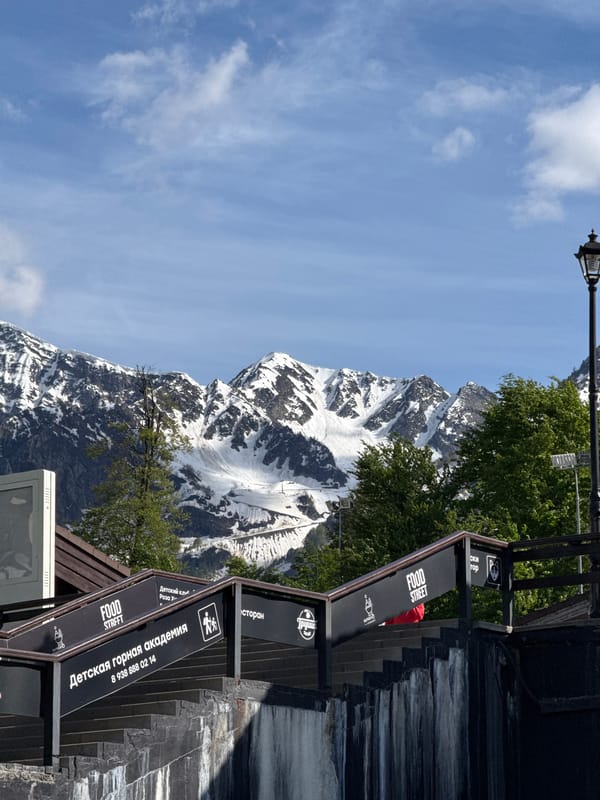 Tourist captures Olympic landmarks and mountain scenery in Estosadok resort