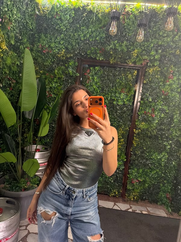 Woman documents restaurant visit with selfies in Rudartsi, Bulgaria
