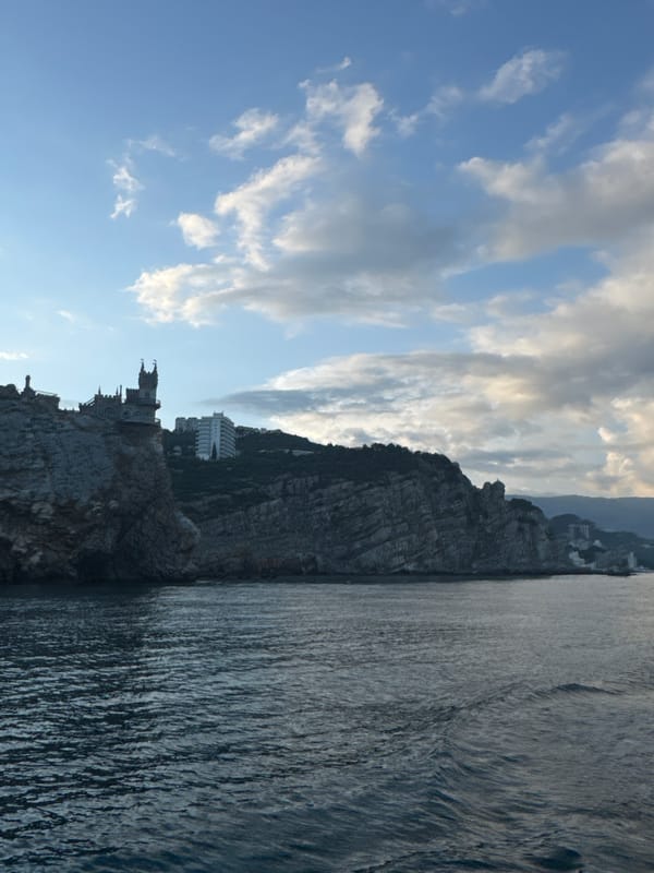 Tourists document Swallow's Nest castle amid construction activity in Gaspra
