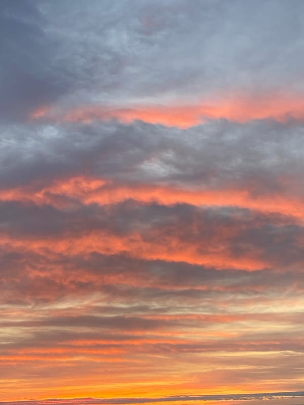 Colorful striated clouds observed during sunset in Izhevsk, Russia