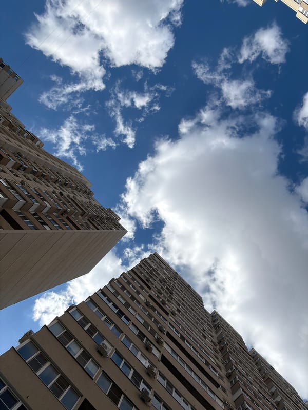 Upward view captured between residential buildings in Krasnodar