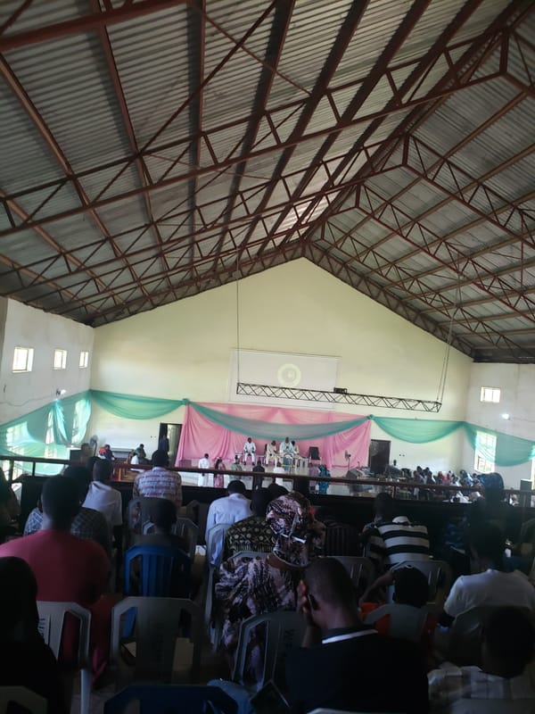 Witness documents indoor gathering and concrete building in Narayi