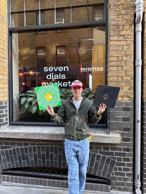 Person with vinyl records spotted outside London shop