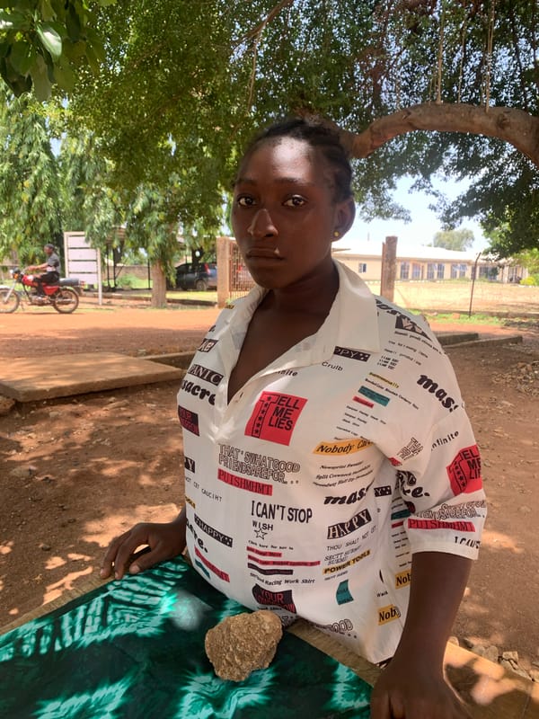 Women conduct outdoor tailoring work in Maigizo, Nigeria
