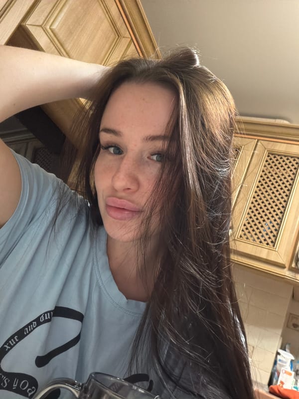 Young woman takes casual selfies indoors in Russia