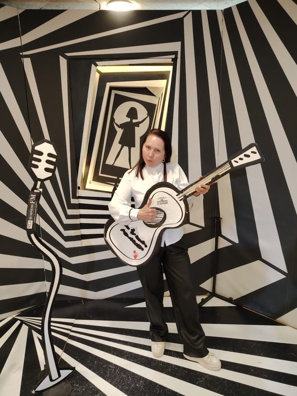Woman poses with optical illusion backdrop in Moscow