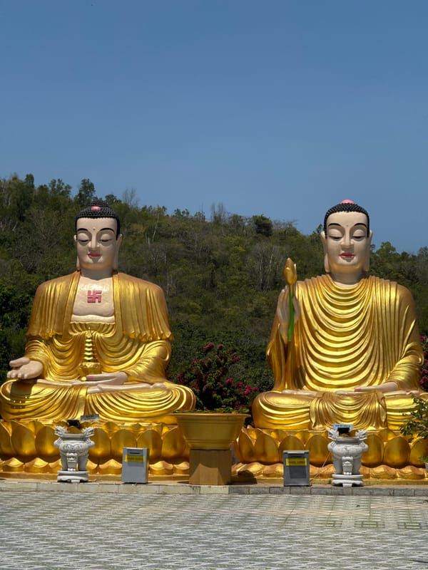Golden Buddha statues photographed at Vietnamese temple shrine