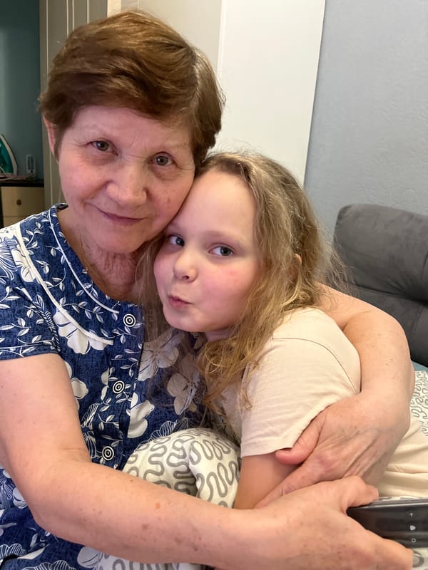 Grandmother and granddaughter share quiet afternoon moments in Izhevsk