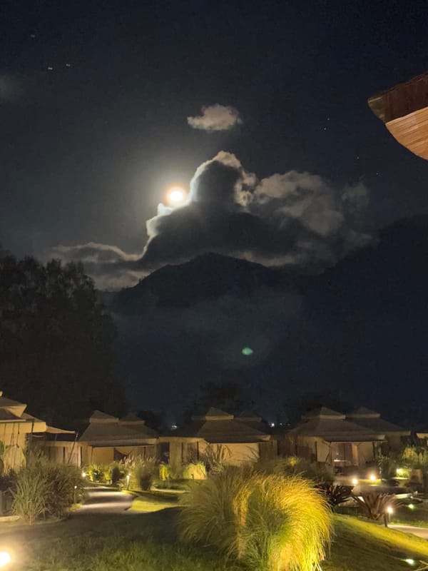 Full moon illuminates Kintamani village through cloudy Indonesian night