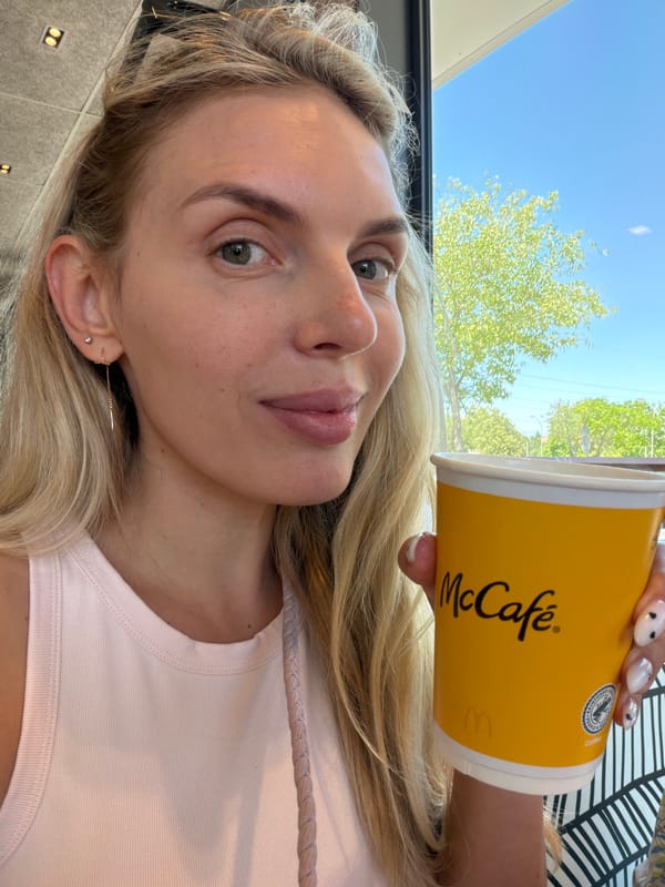 McCafé stop in suburban Madrid with a Spanish flag nearby
