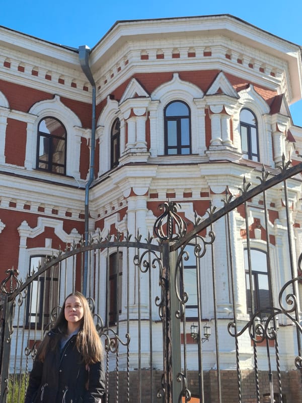 Woman photographed among historic buildings in Sarapul, Russia