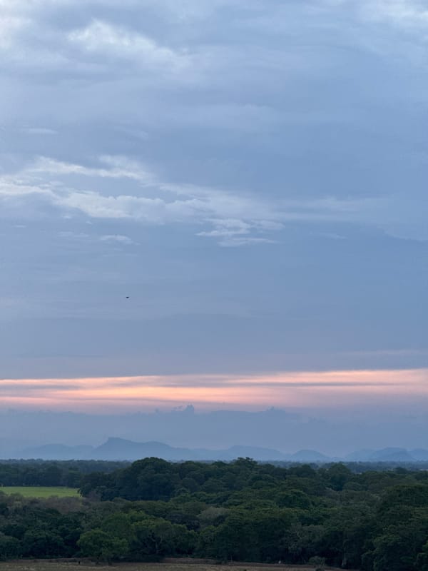 Sweeping views of Shastrawela's cliffs, coast, and cloudy skies