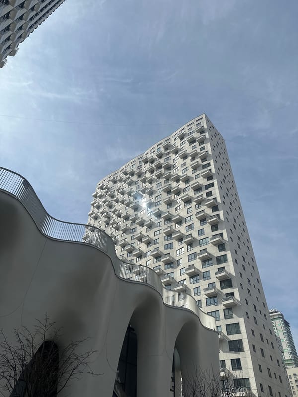 Morning sunlight illuminates geometric apartment buildings in Moscow