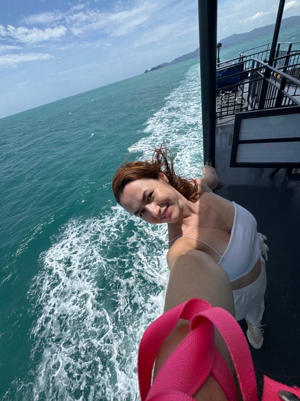 Ferry crossing Thai waters, selfies on deck, crew at work