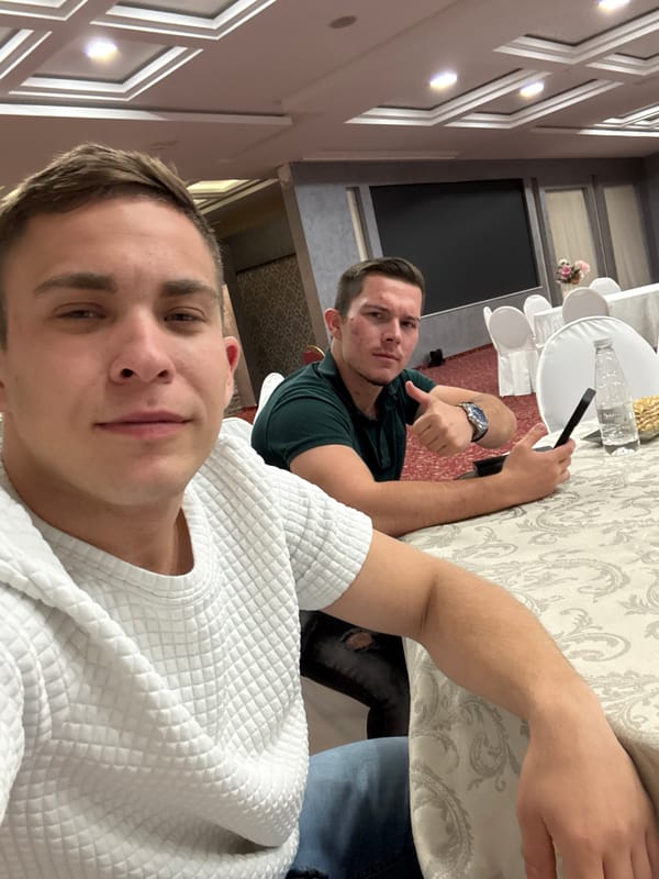 Two men take selfies at banquet hall in Sliven