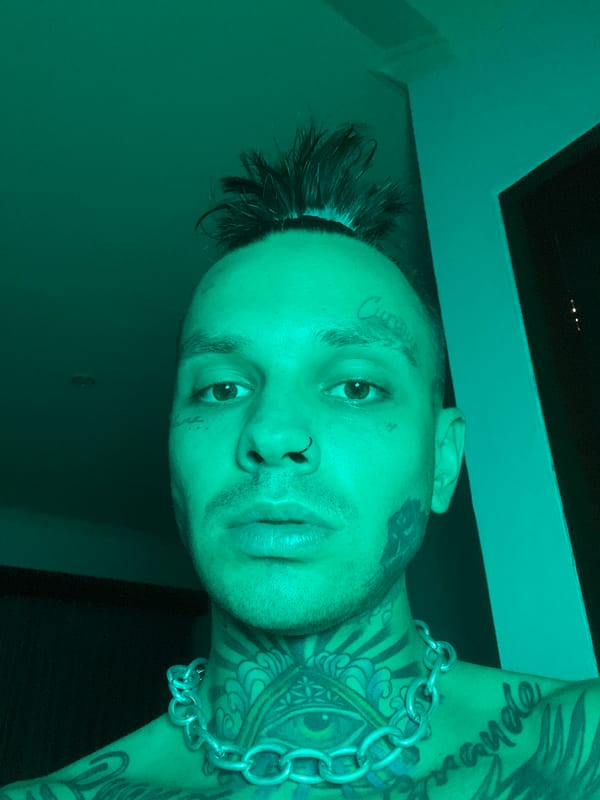 Styled selfie series with bold tattoos and moody lighting