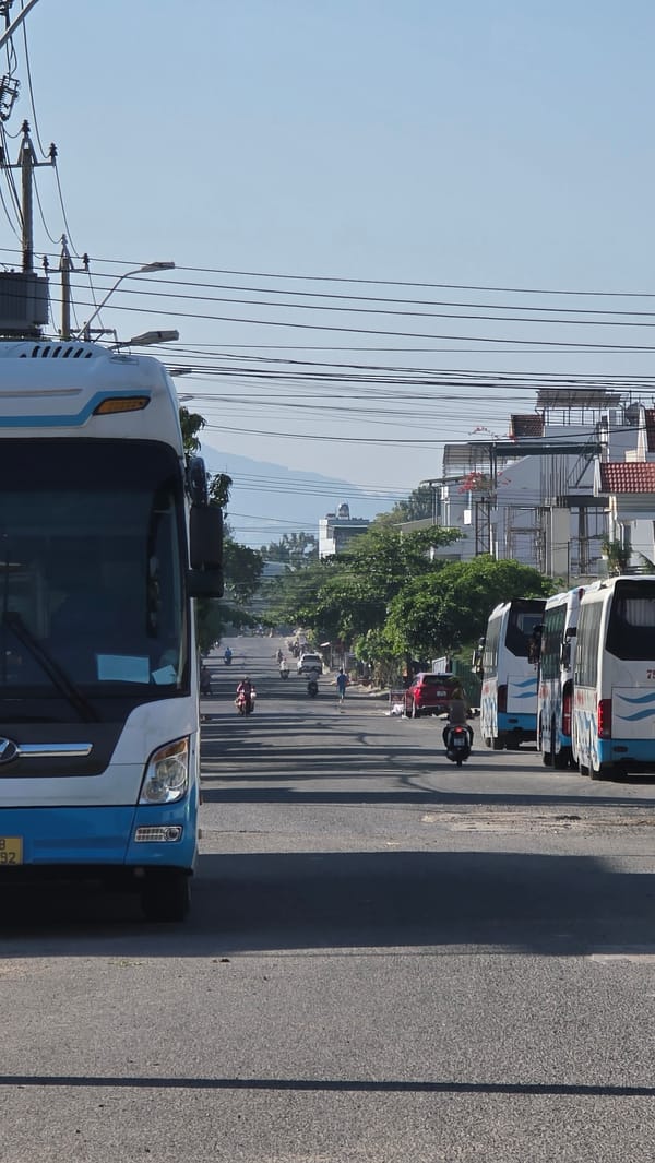 Late-night bus washing operation documented at Vietnam transport depot