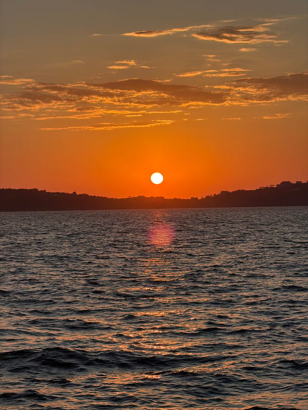 Sunset observed over waters of Procida, Italy