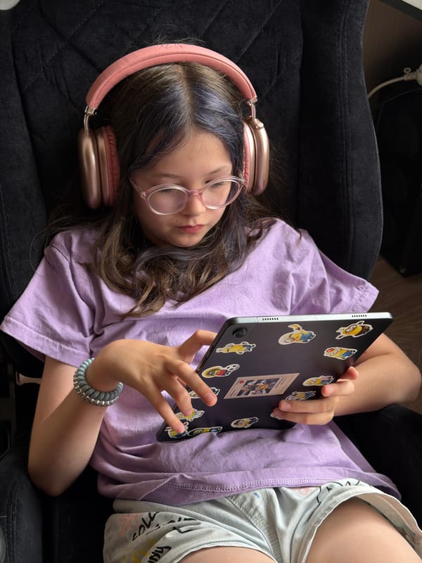 Girl with tablet, Chihuahua play among stuffed animals in Russia