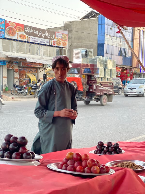 Everyday street life on a Kandahar road, mid-afternoon.
