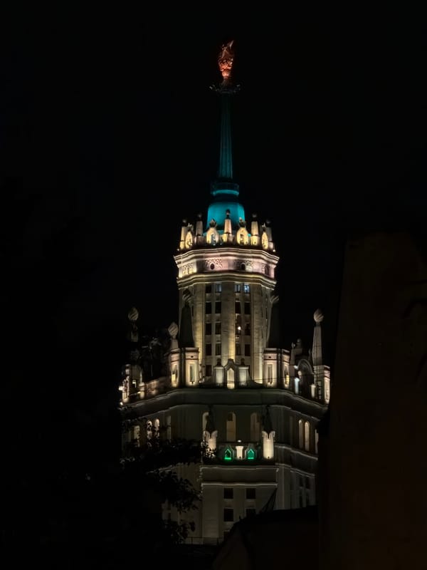Illuminated spired building observed in Moscow at night