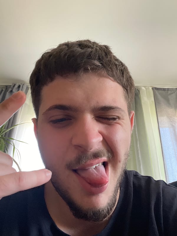Man makes playful faces in Dragijevo, Bulgaria indoor setting
