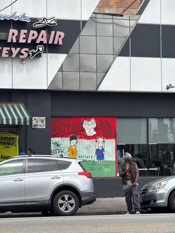 Evening street documentation captures LA business signage, parking areas