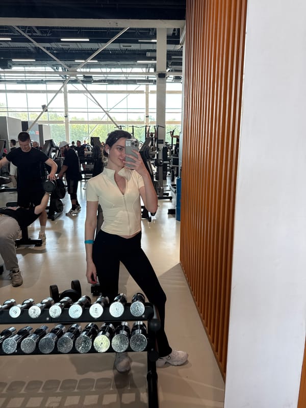 Woman's workout day documented through gym selfies and waterfront visit
