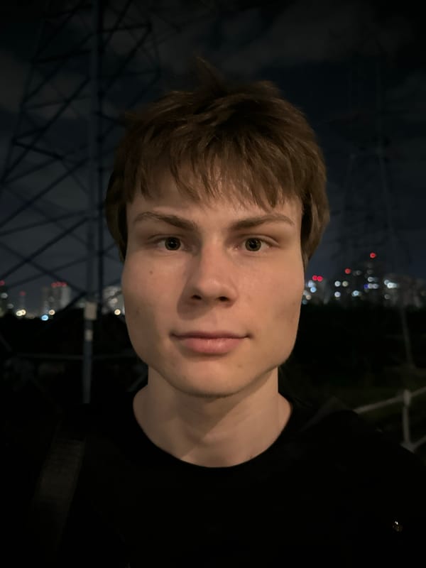 Portrait captured against Moscow nighttime skyline backdrop