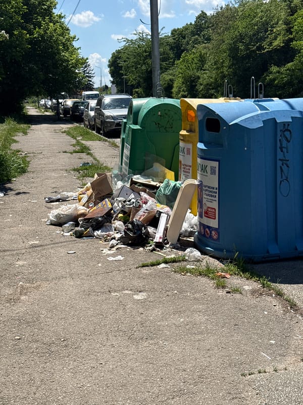 Overflowing trash documented beside recycling bins in Lovech, Bulgaria