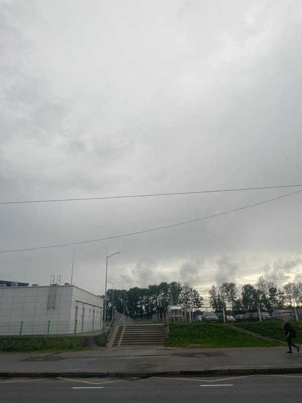Rainy afternoon drive through a Russian-speaking city