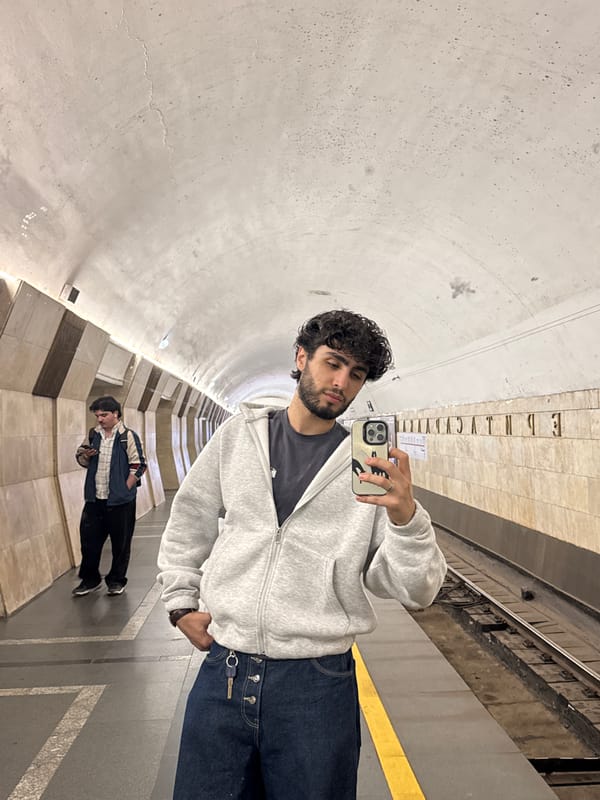 Man Takes Selfie at Subway Station
