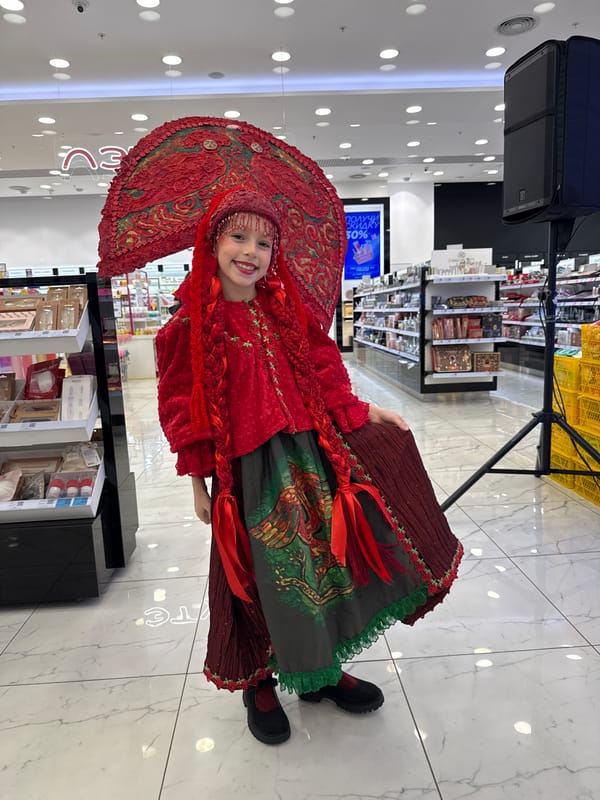 Traditional attire and pastry displays spotted in Vladivostok shopping areas