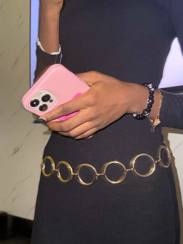 Person with pink iPhone and jewelry observed in Igboefon
