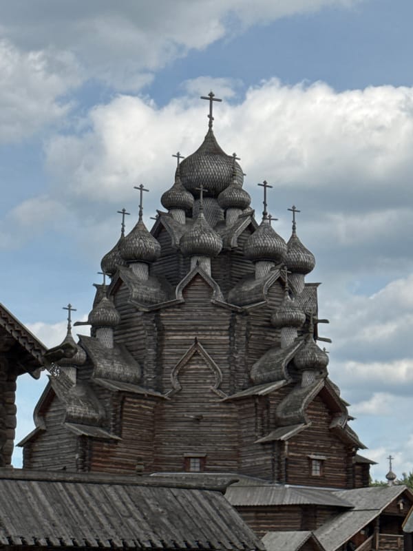 Wooden Orthodox church and playground in Petro-Slavyanka, Russia