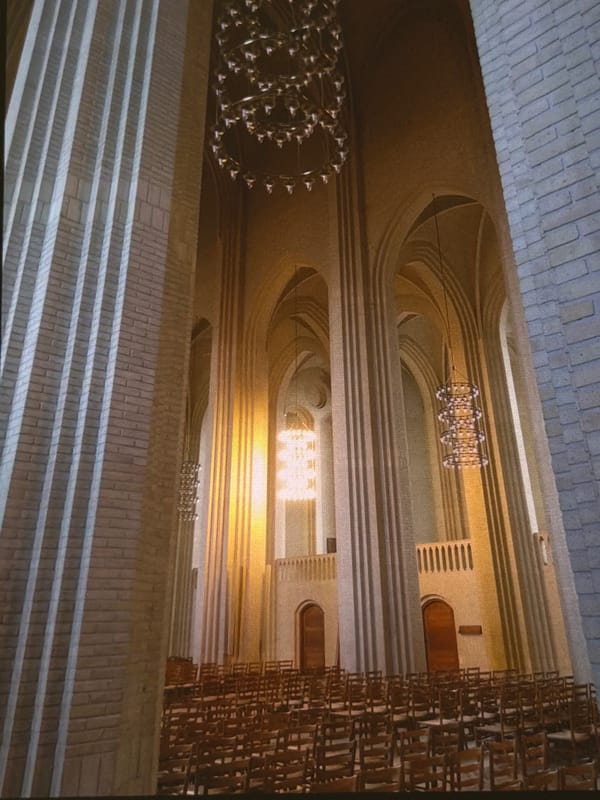 Inside Dresden's Frauenkirche, with chandeliers, columns, and oysters