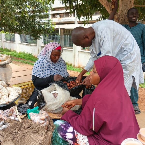 Daily market commerce and dining captured in Shaba, Nigeria