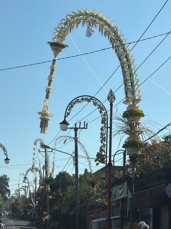 Ceremonial procession and street activity in Gianyar, Bali