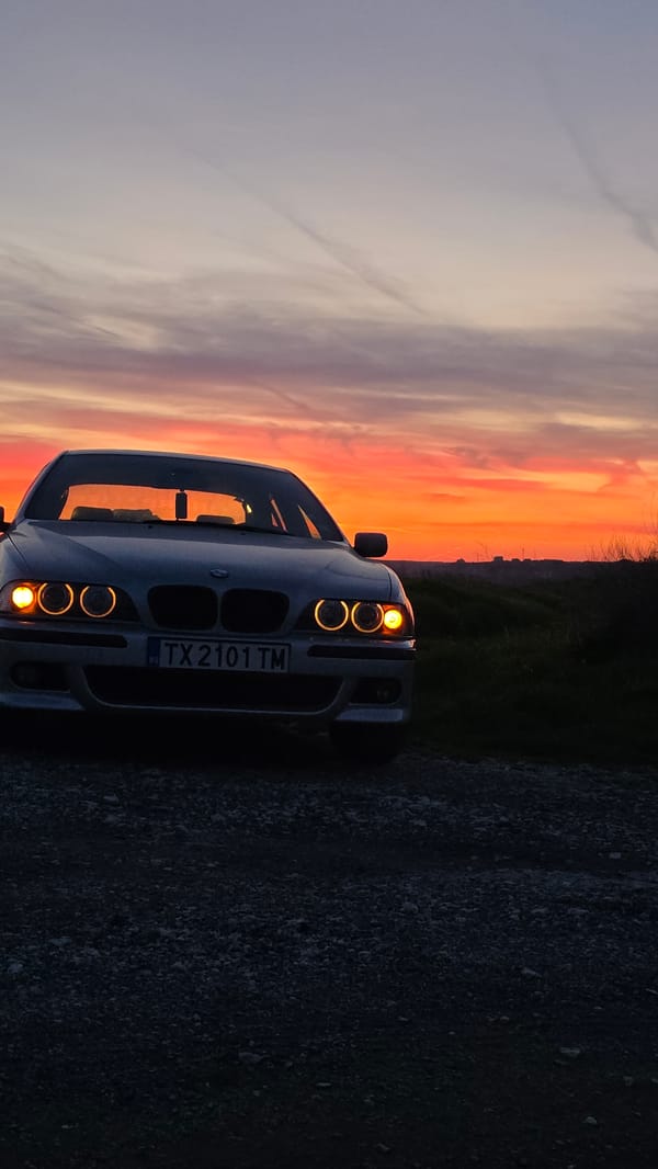 Sunset documented over coastal Balgarevo, Bulgaria with parked BMW