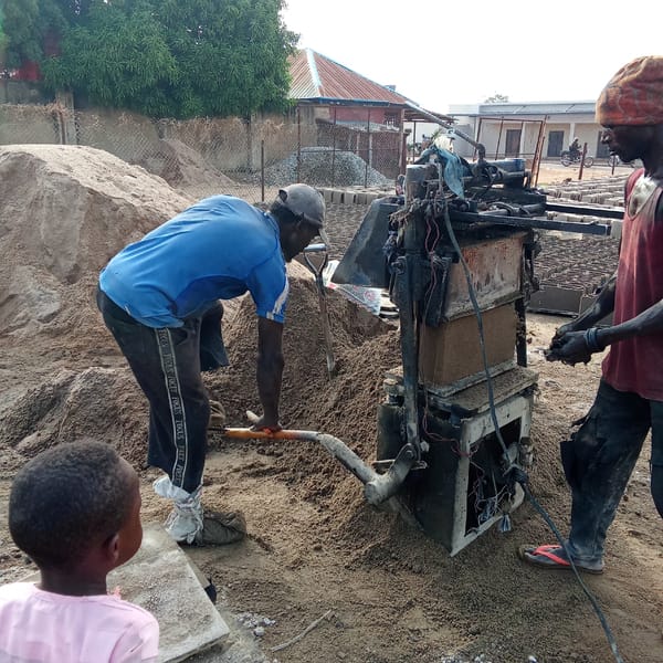 Manual block-making operation documented in Akwanga, Nigeria