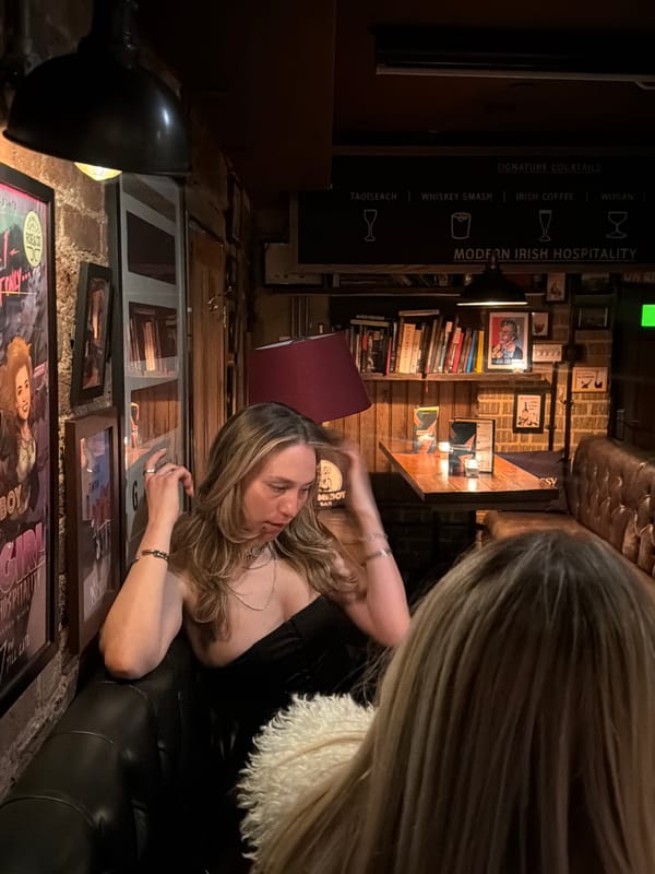 London bar patrons capture moments with phones during evening