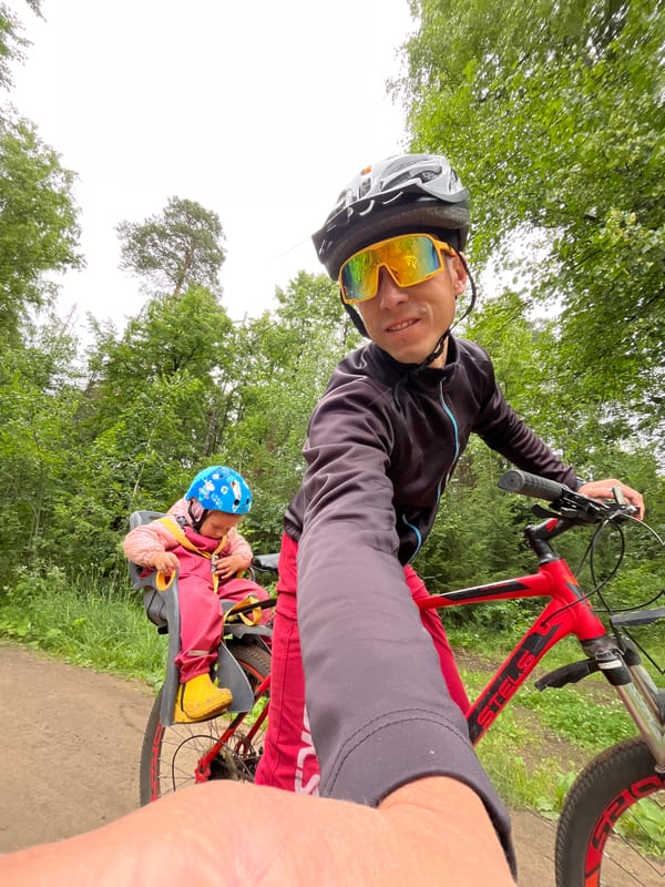 Family bike ride through forest trails in Chaikovsky, Russia