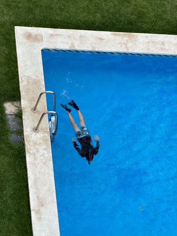 Summer evening at a Valencia residential complex: pools, cava, and courtyard hangs