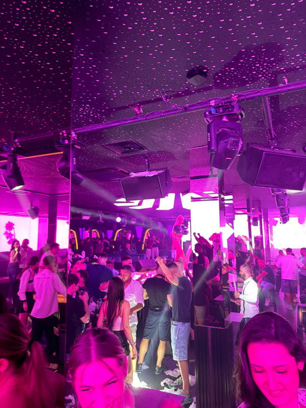 Late-night club scene in Sofia with neon lights and hookah