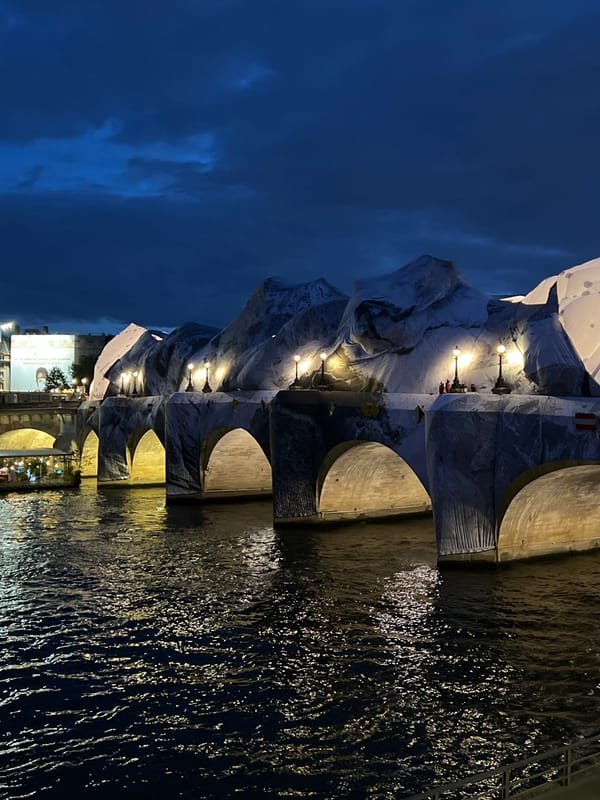 White fabric art installation transforms Paris bridge into alpine landscape